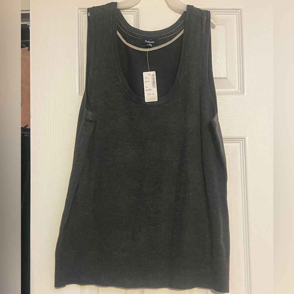Grey scoop neck vest that adds sophistication to business casual ensemble.